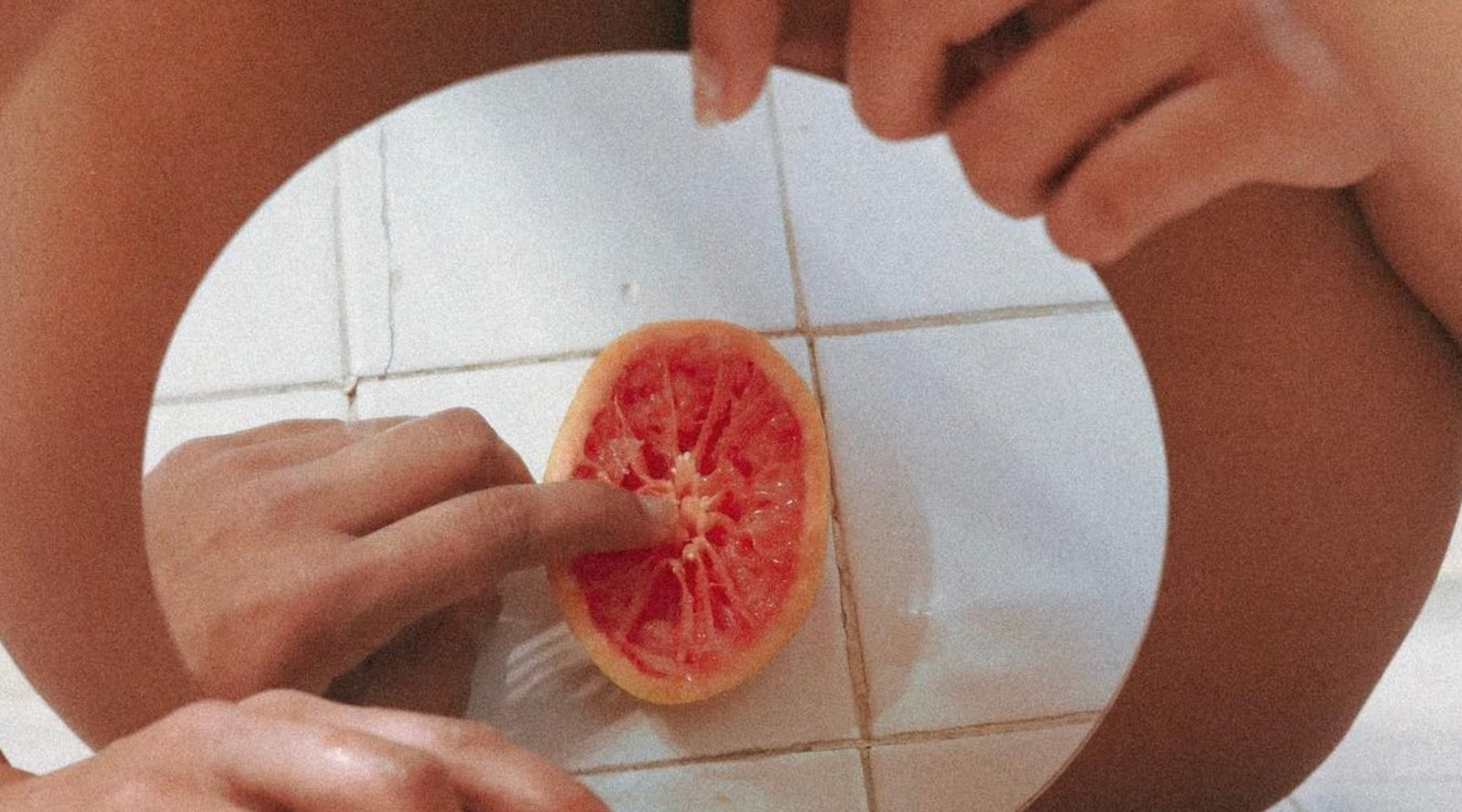 Women Wearing Their Underwear Holding a Sliced Grapefruit · Free Stock Photo